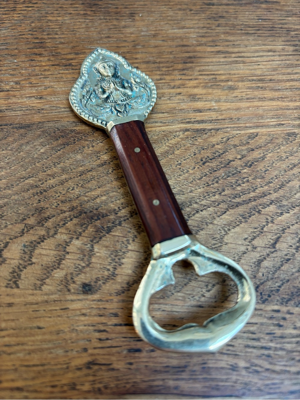 Vintage Brass and Wood Bottle Opener. Bottle Embossed Hindu Deity Design.